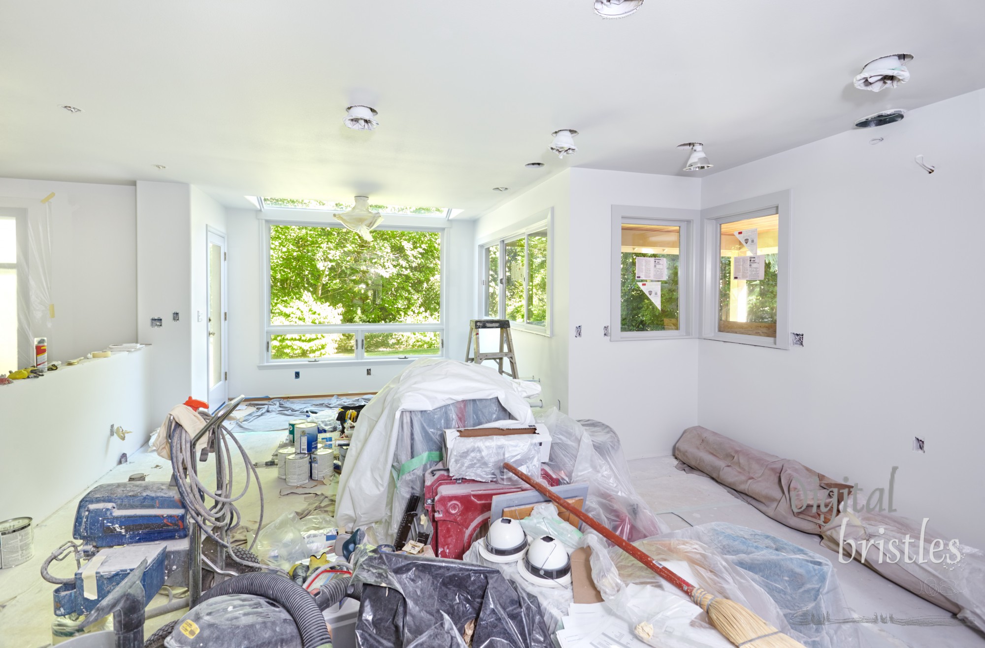 Kitchen tools, supplies and equipment piled up during painting of walls and ceiling