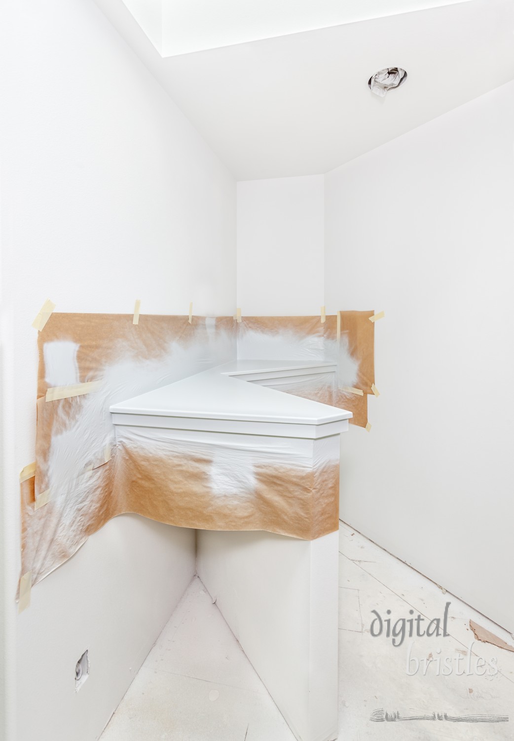 Painting shelf top in angled corner of master bathroom, masking and taping off walls