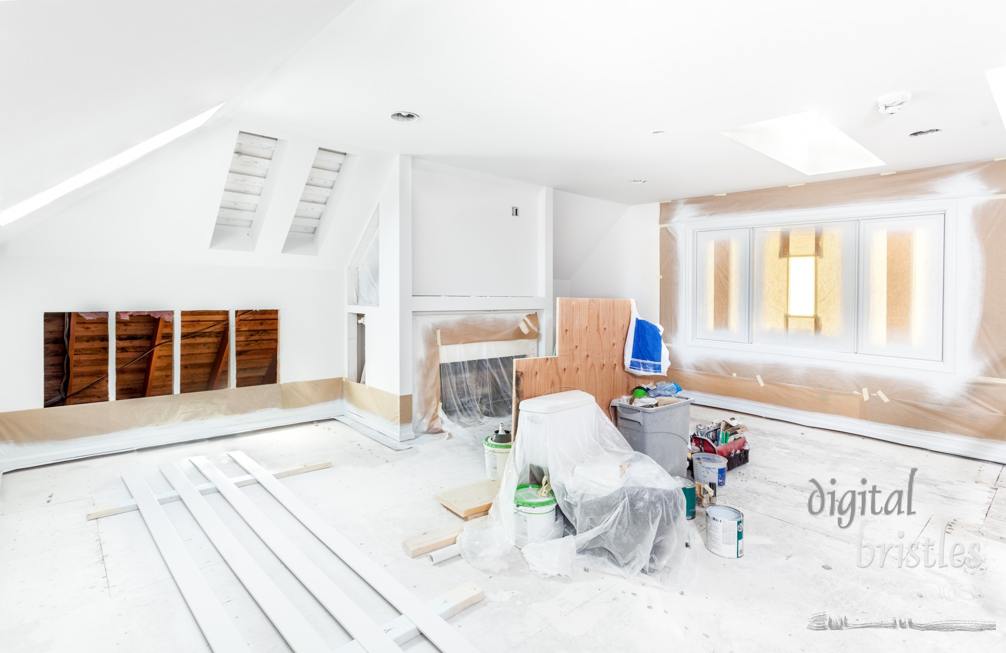 Windows and wall masked with paper and plastic for spraying trim; trim strips sprayed and dried on the floor