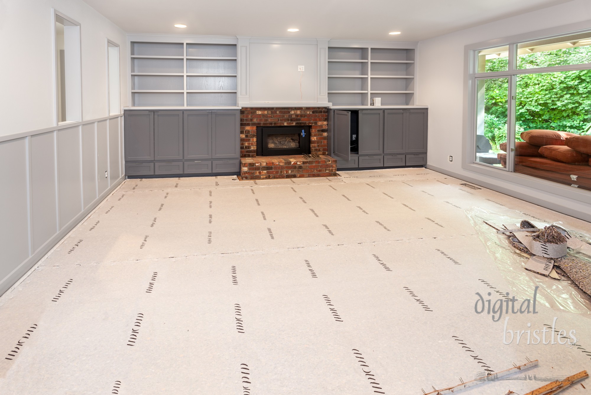 New carpet padding installed in family room in preparation for carpet installation