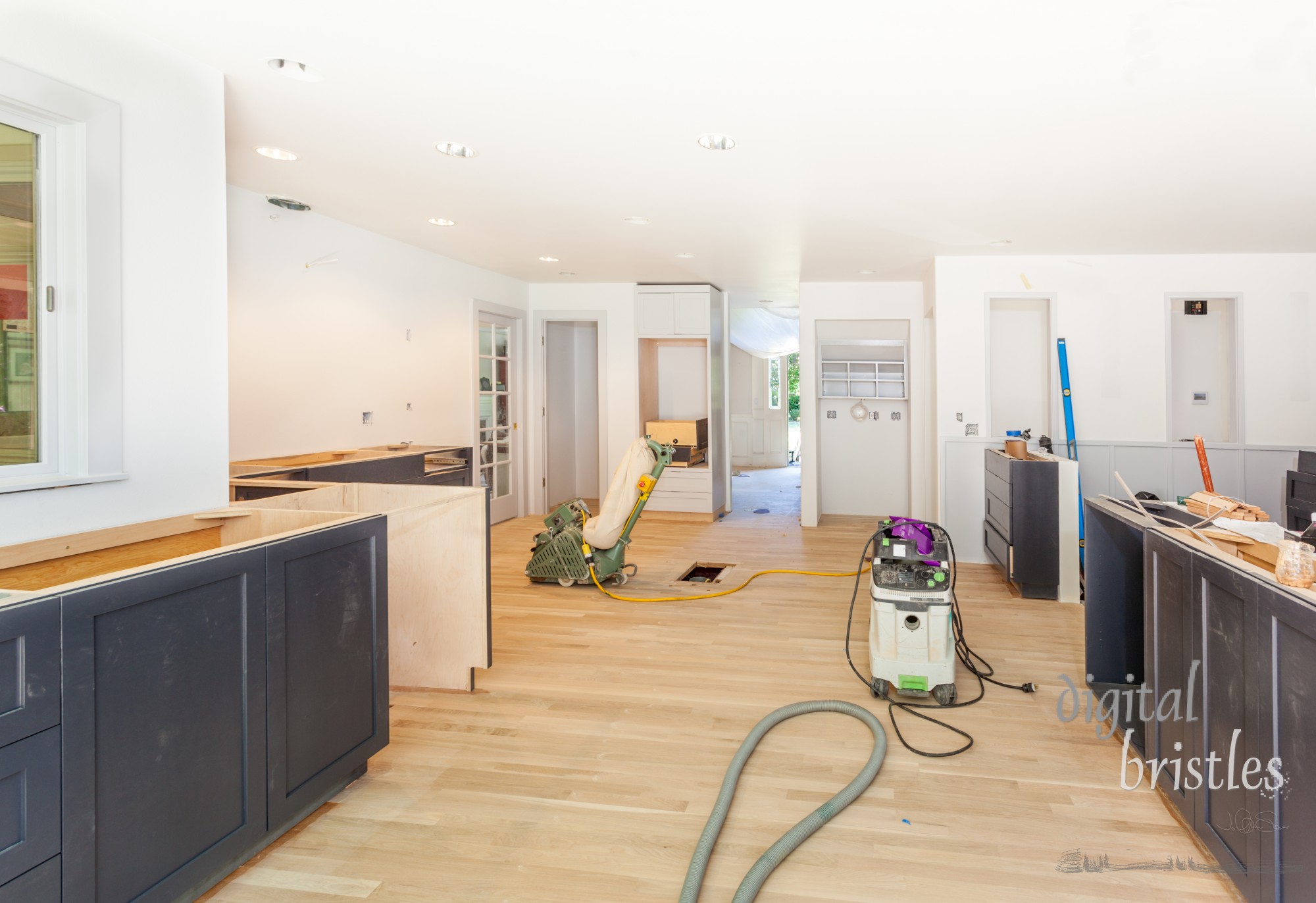 Filler is applied and sanded off to refinish a patched 20-year-old hardwood floor