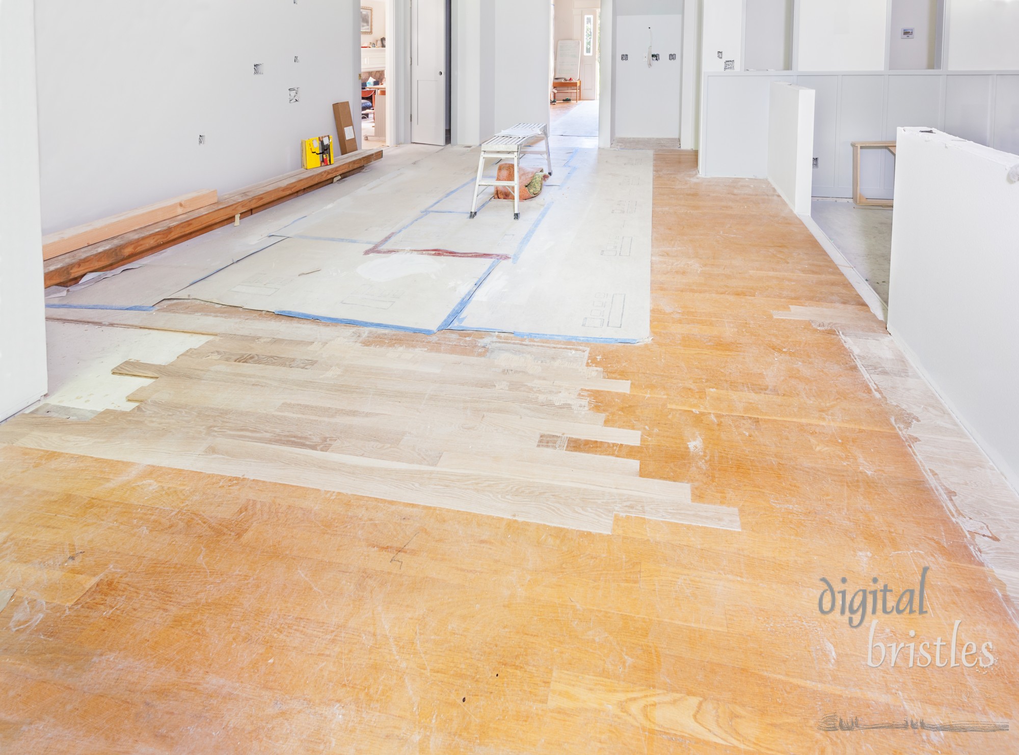 Inserting new wood into floor areas exposed by the remodel