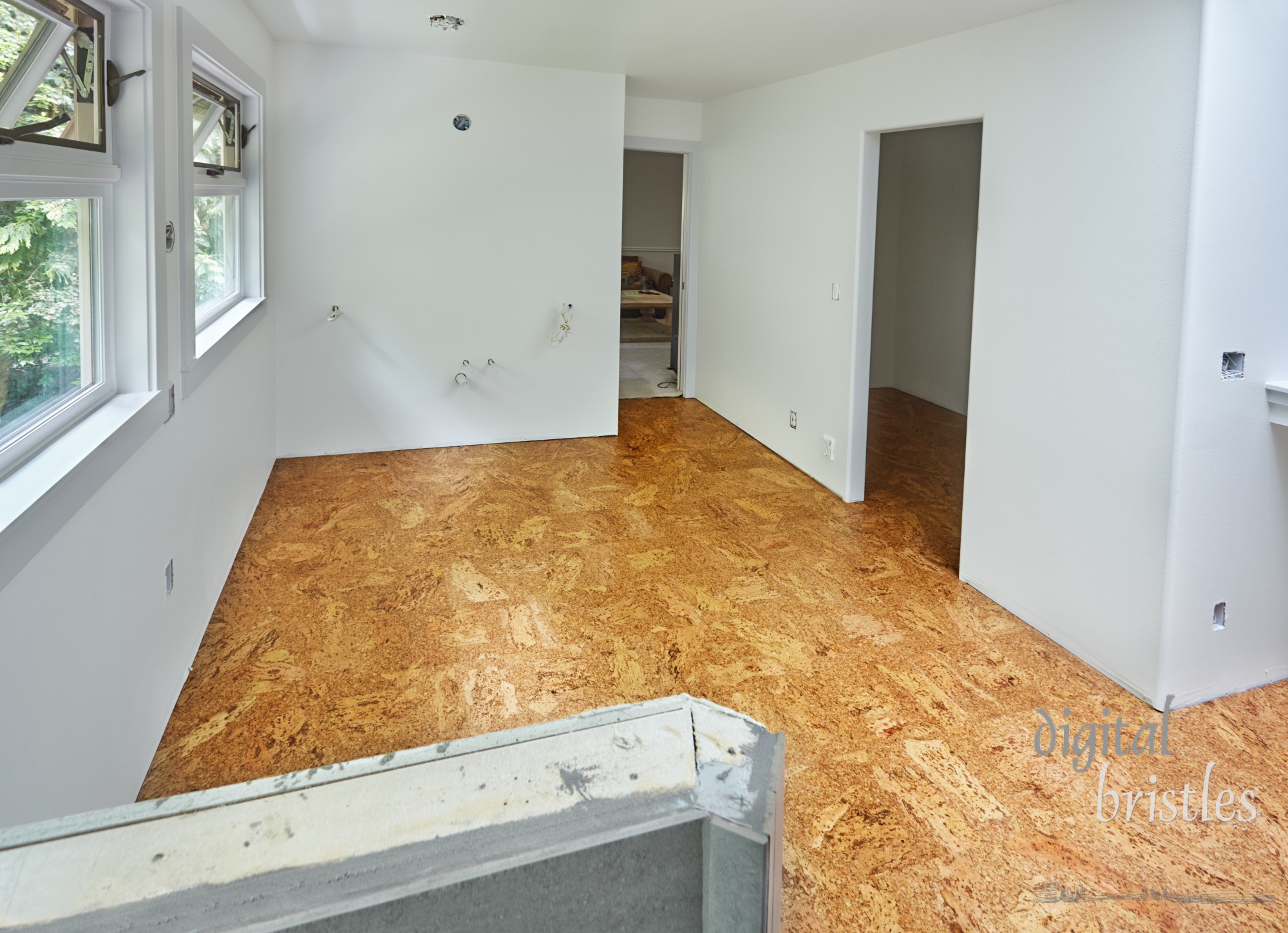 Cork floor tiles installed in bathroom and walk-in closet