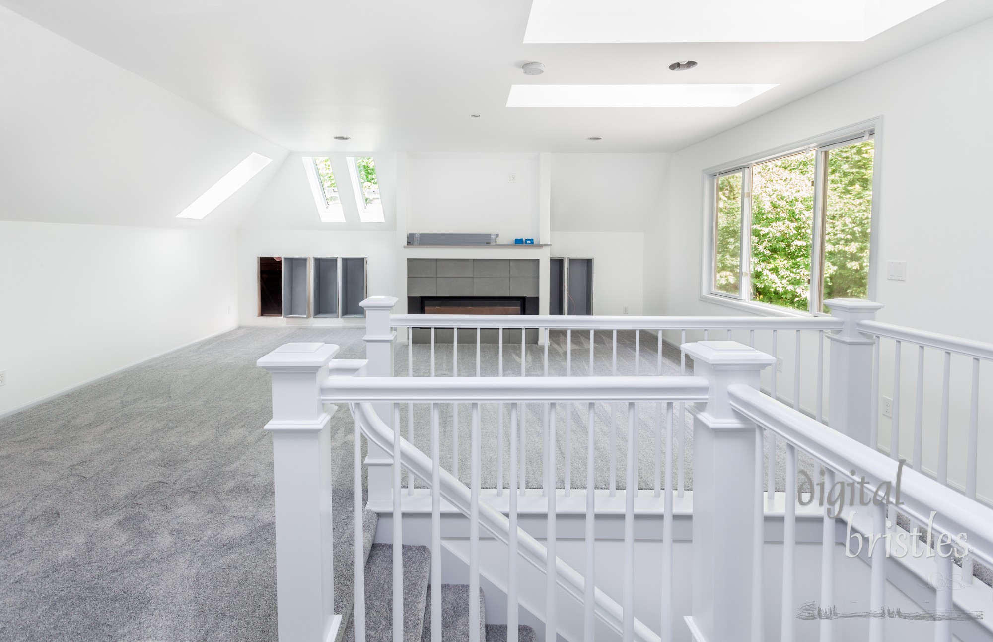 Room and stairs carpeted in pale gray during remodeling