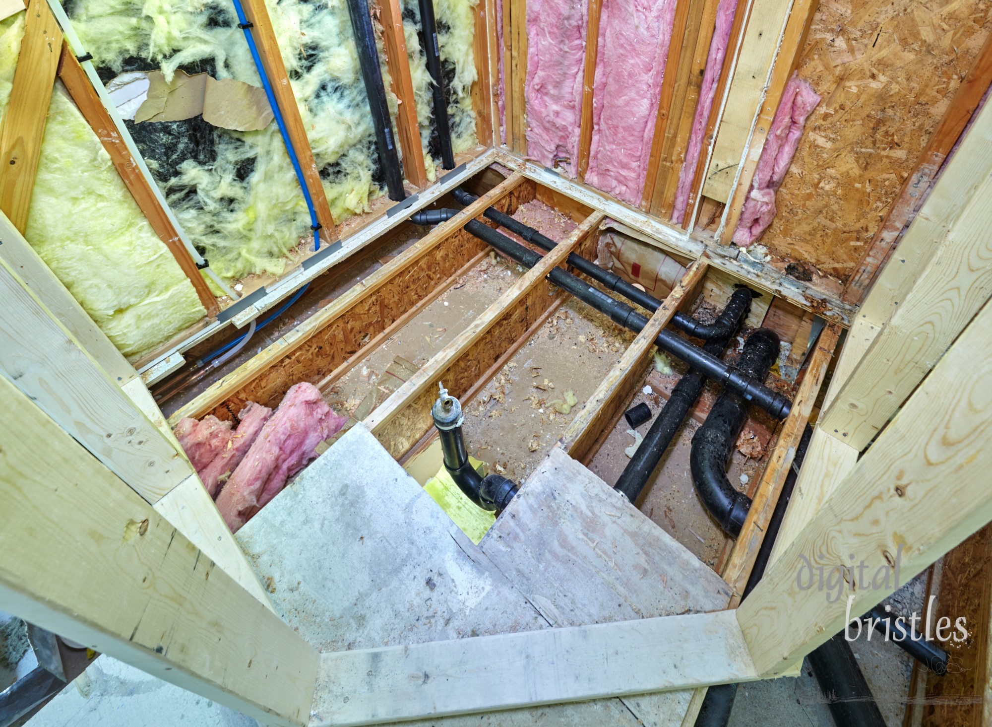 Relocated bathroom shower framed. Water supply and drain pipes installed and old copper pipes connected to new plastic ones.