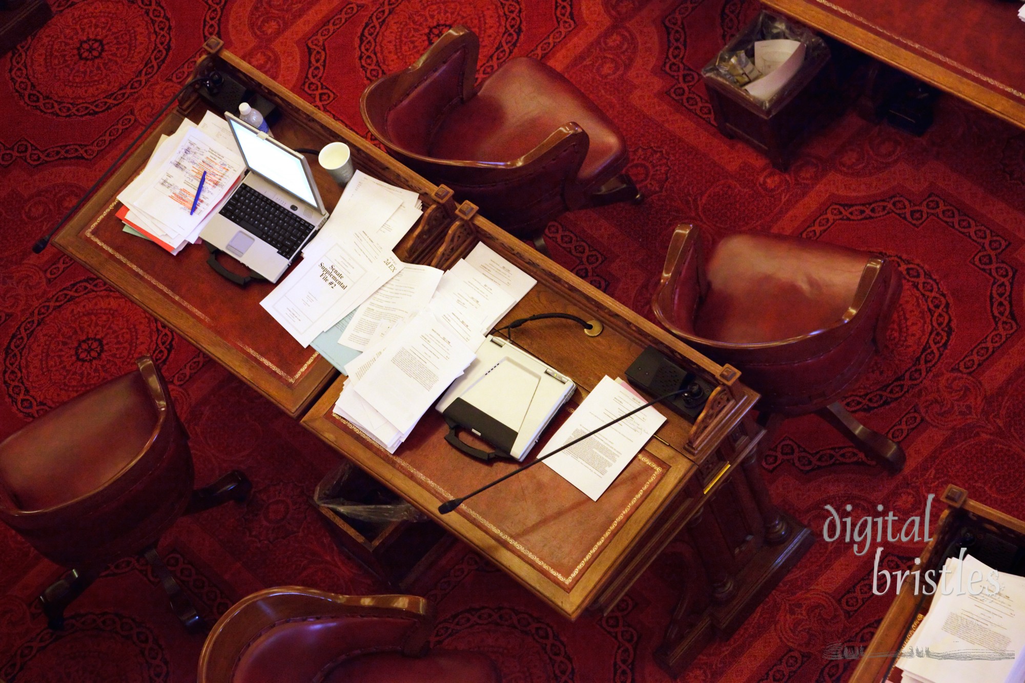 Cluttered desks in the California State Senate chamber