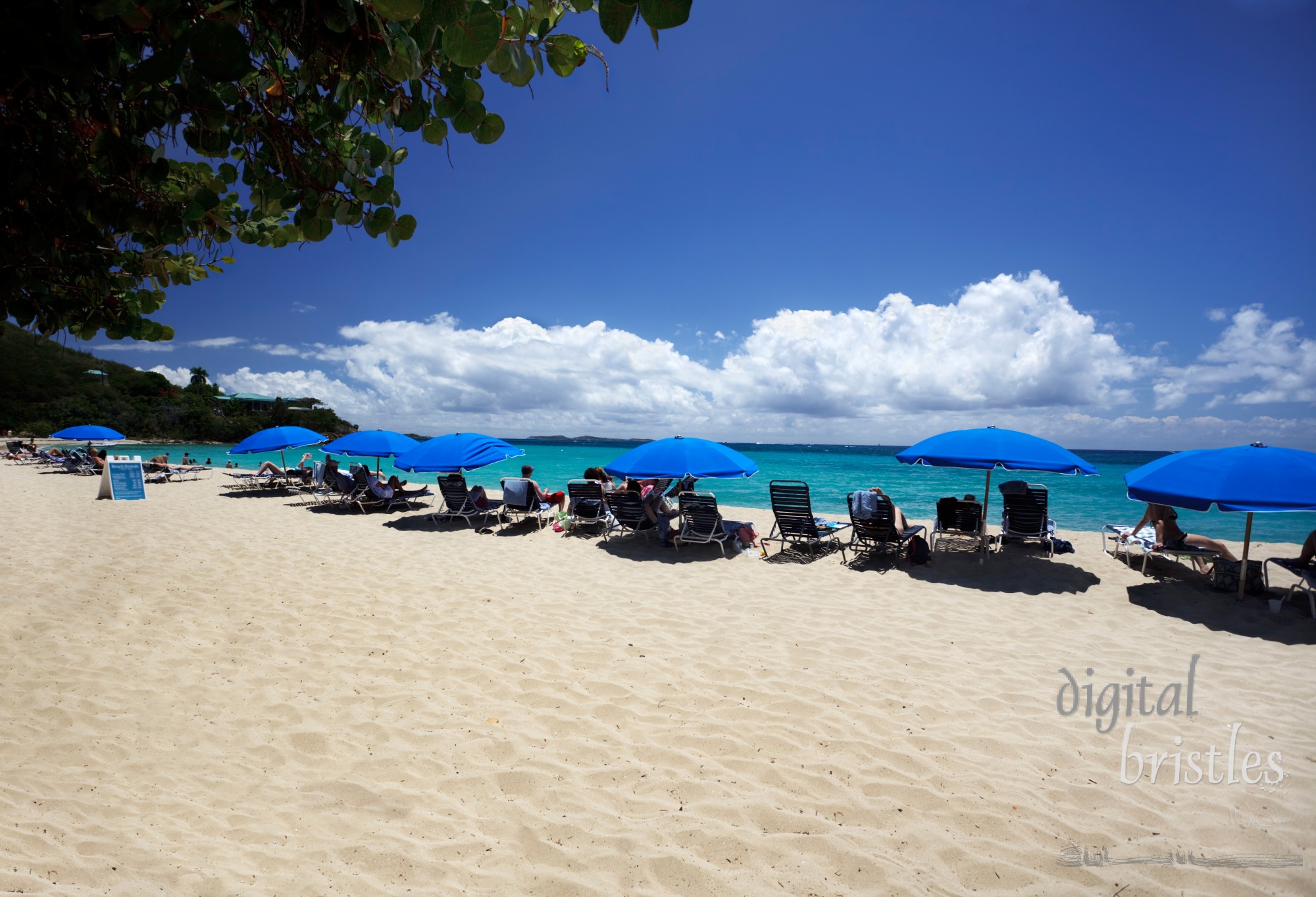 Beachgoers relaxing at a Caribbean resort