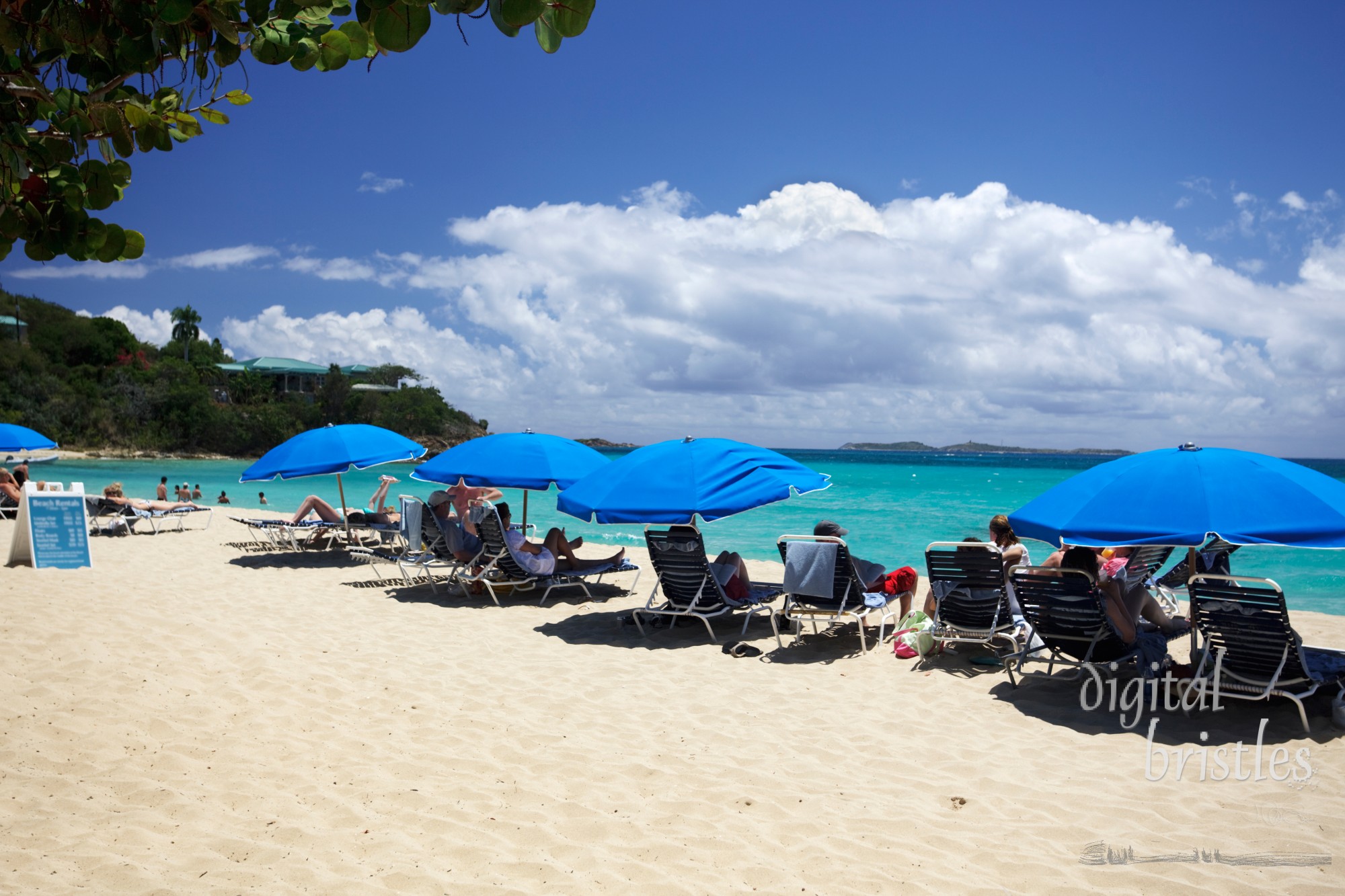 Beachgoers relaxing at a Caribbean resort