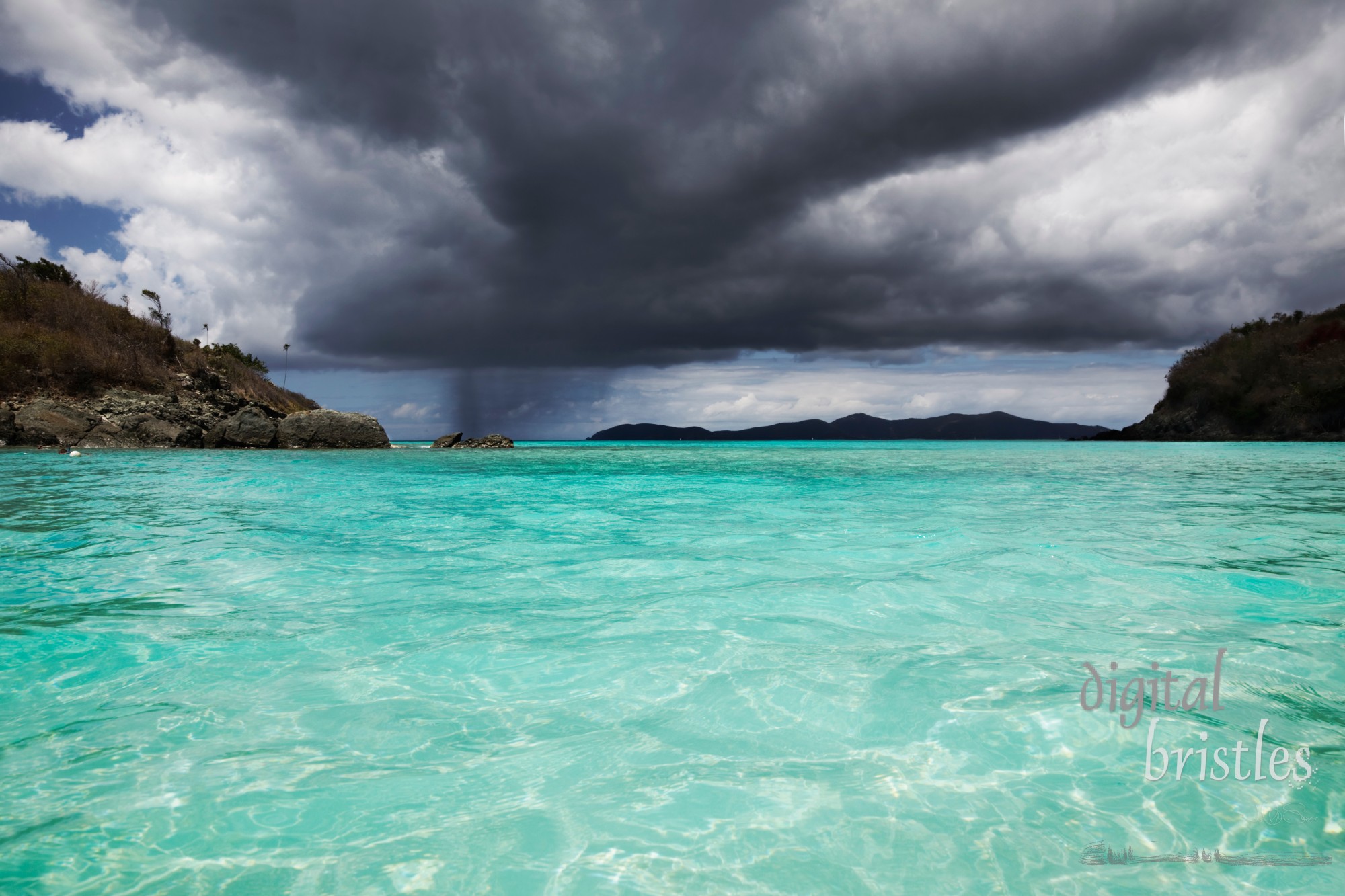 Rain at the horizon as the dark clouds approach