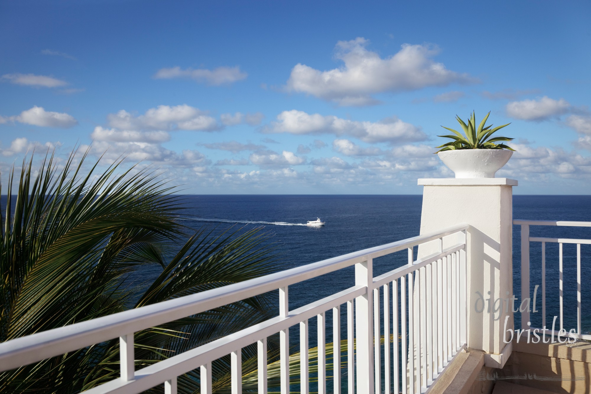 Cliff-top terrace looking out over a tropical ocean