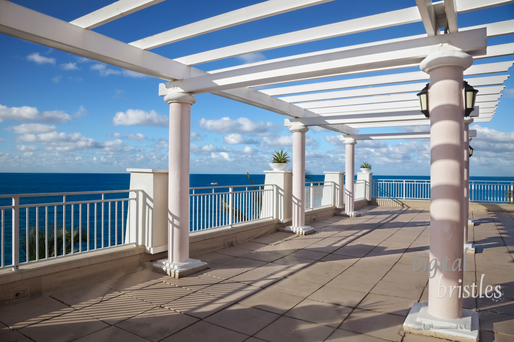 Cliff-top terrace looking out over a tropical ocean