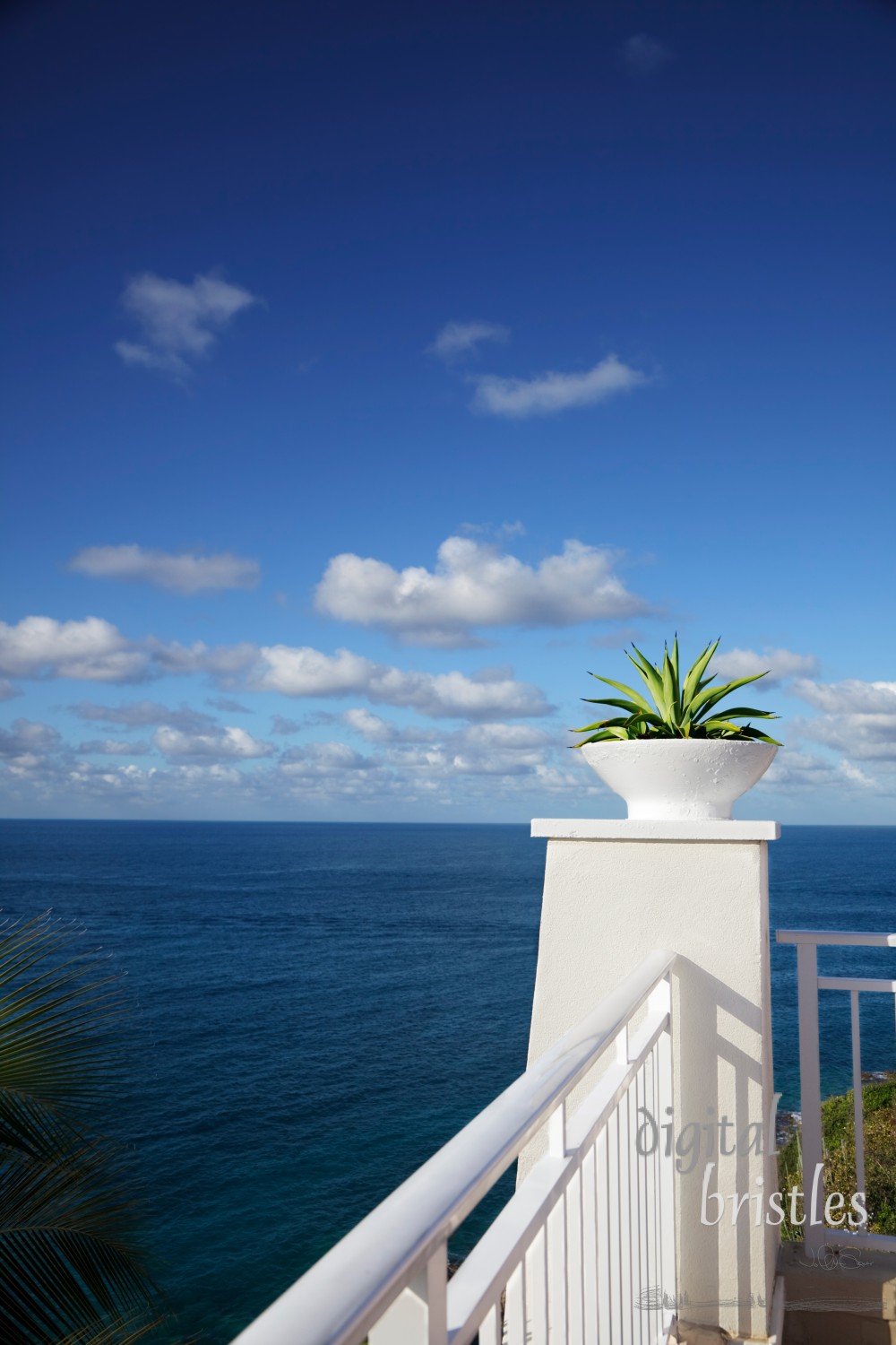 Cliff-top terrace looking out over a tropical ocean