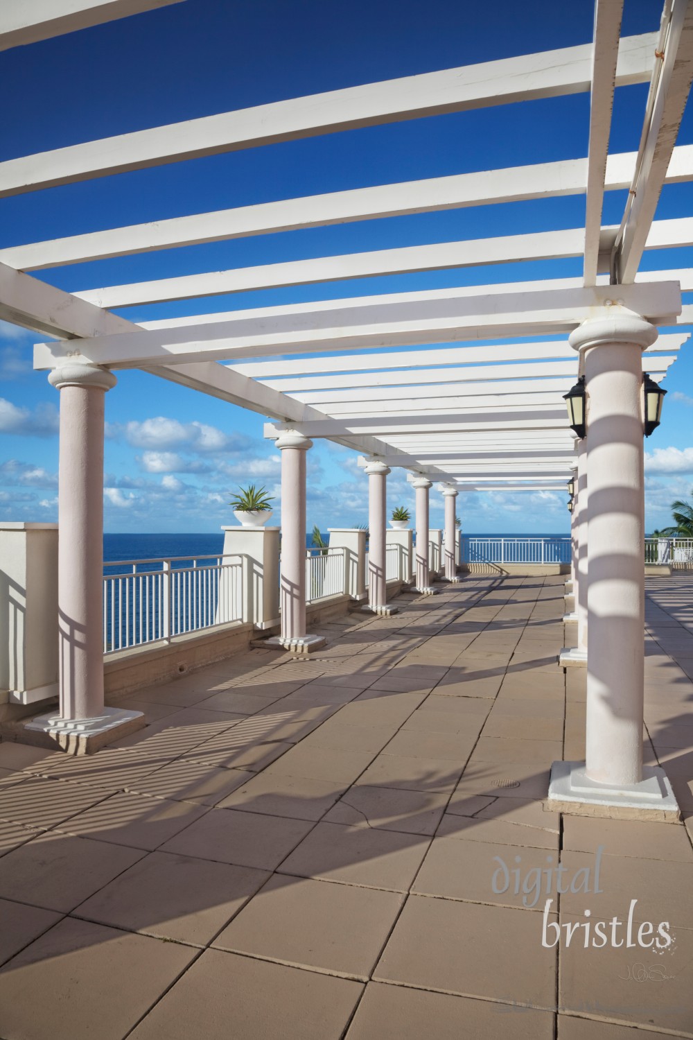 Cliff-top terrace looking out over a tropical ocean