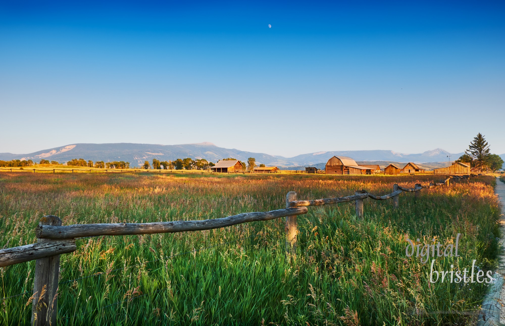 Mormon Row barns, Antelope Flats in Grand Teton National Park, Wyoming, looking towards Gros Ventre wilderness