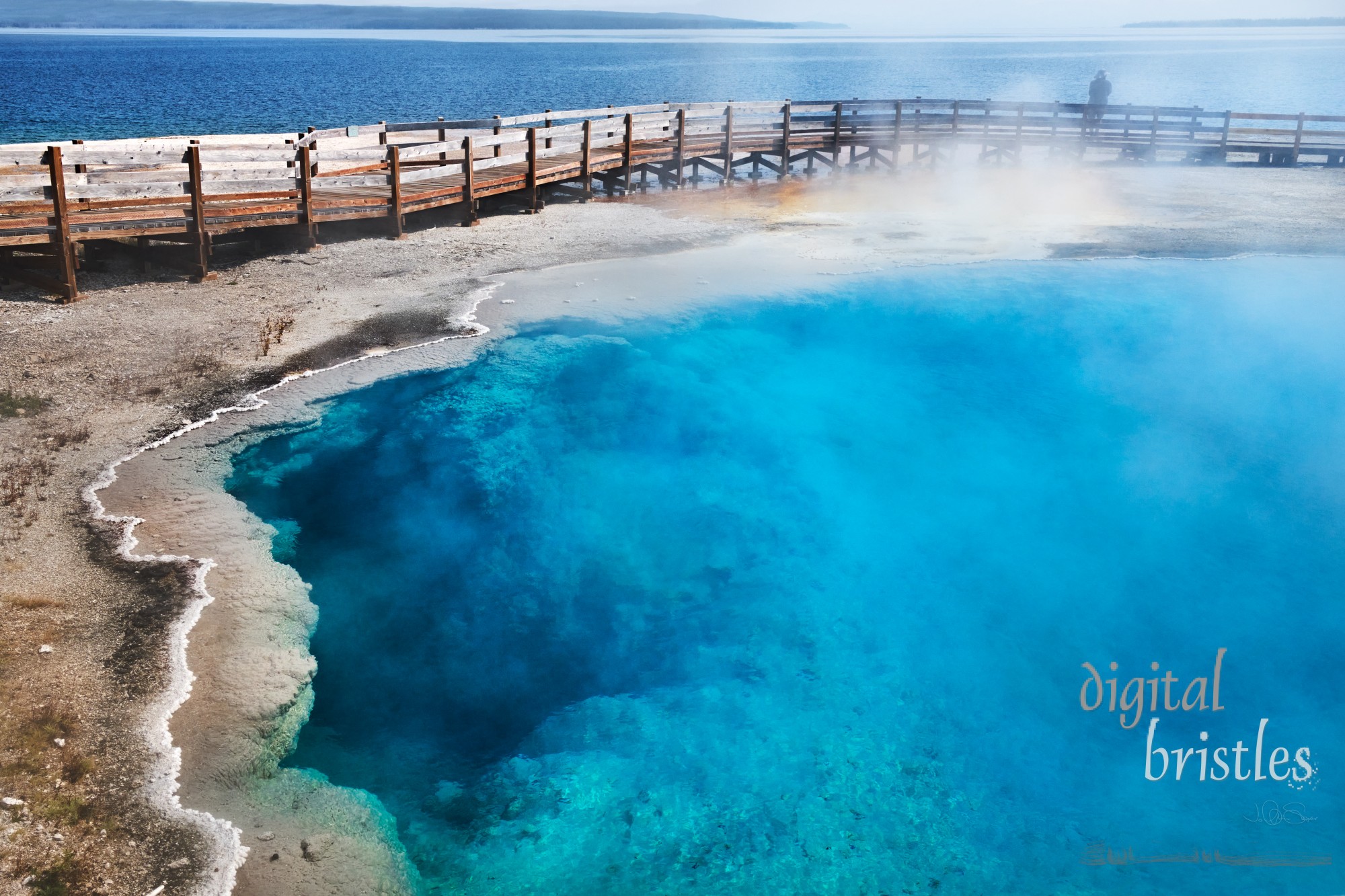 Boardwalk around Black Pool overlooking Yellowstone Lake, Wet Thumb Geyser Basin. Yellowtone National Park, Wyoming