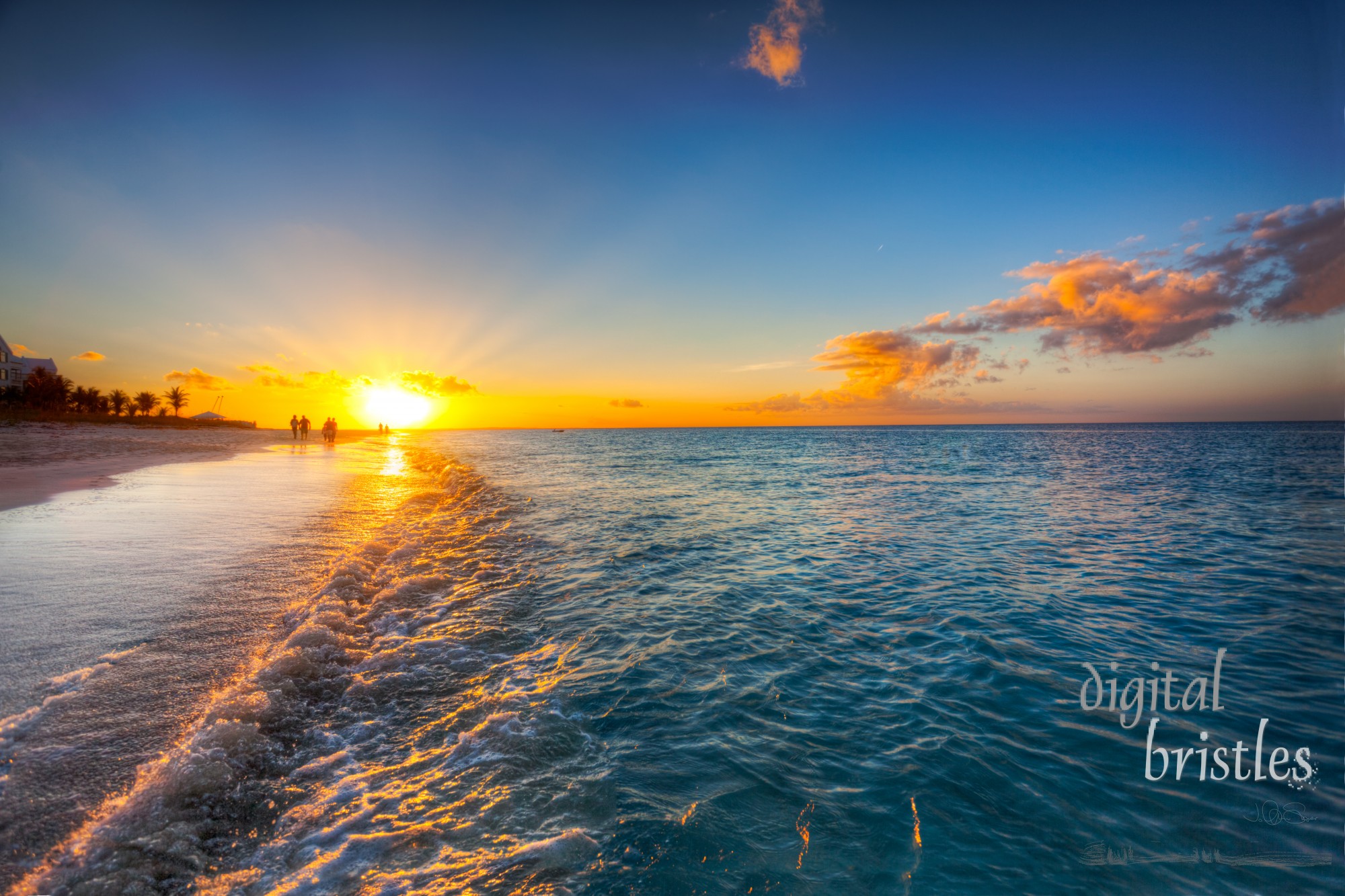 Grace Bay Beach, Turks & Caicos, with the setting sun at the horizon