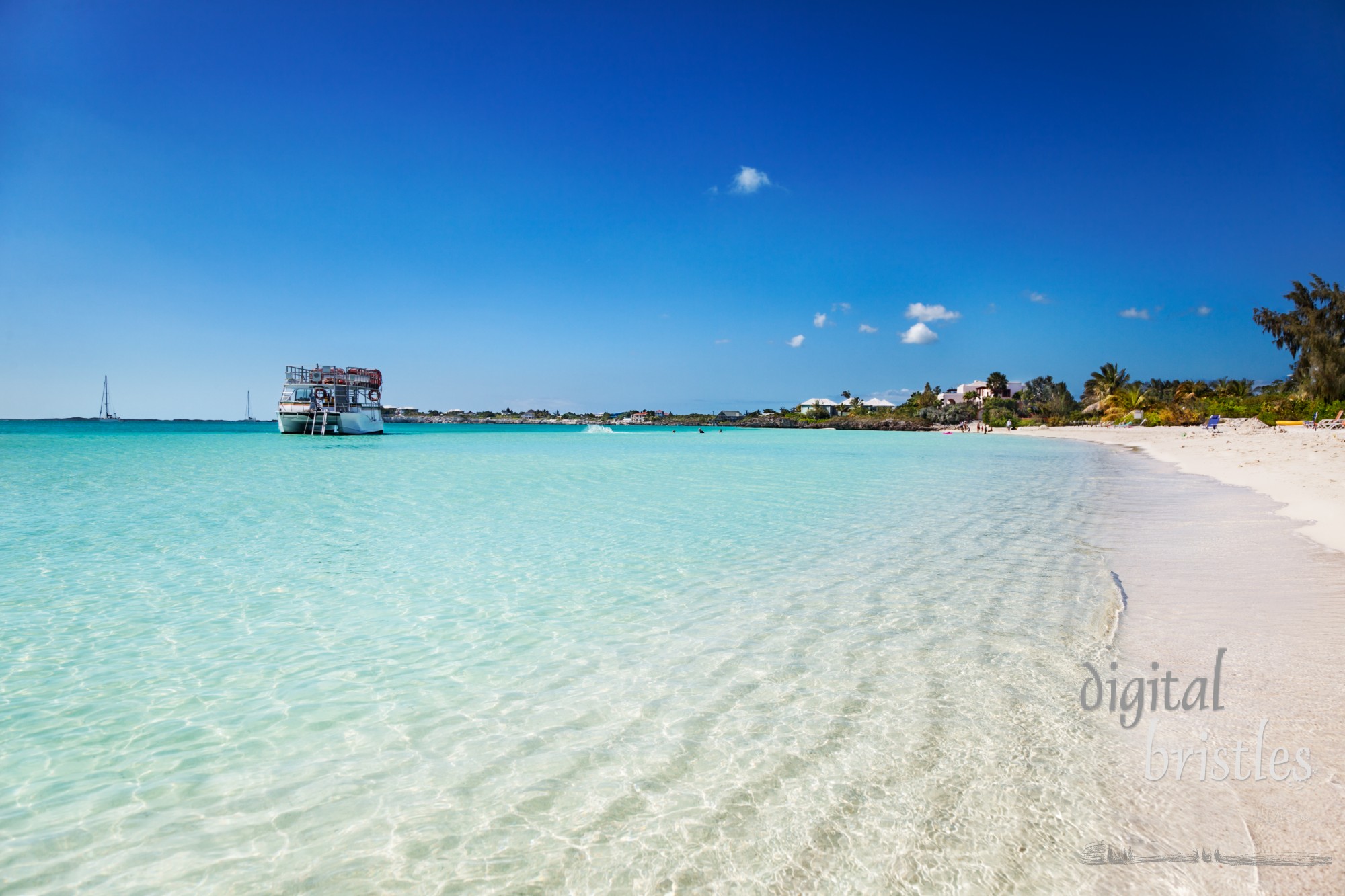 The calm shallow waters and white sands of Sapodilla Bay, Turks & Caicos