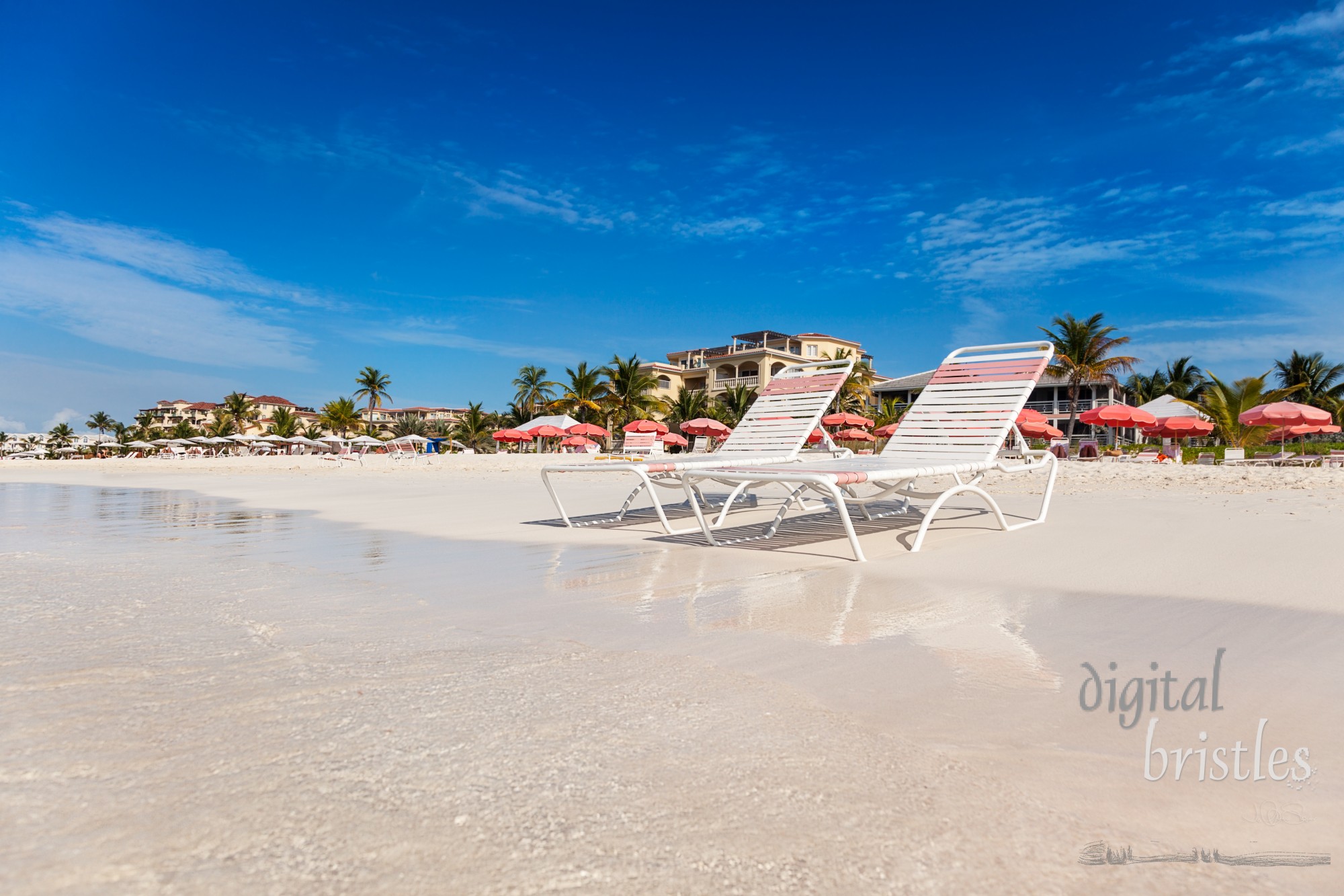 Two chairs on the white sands of Grace Bay Beach, Providenciales, Turks and Caicos