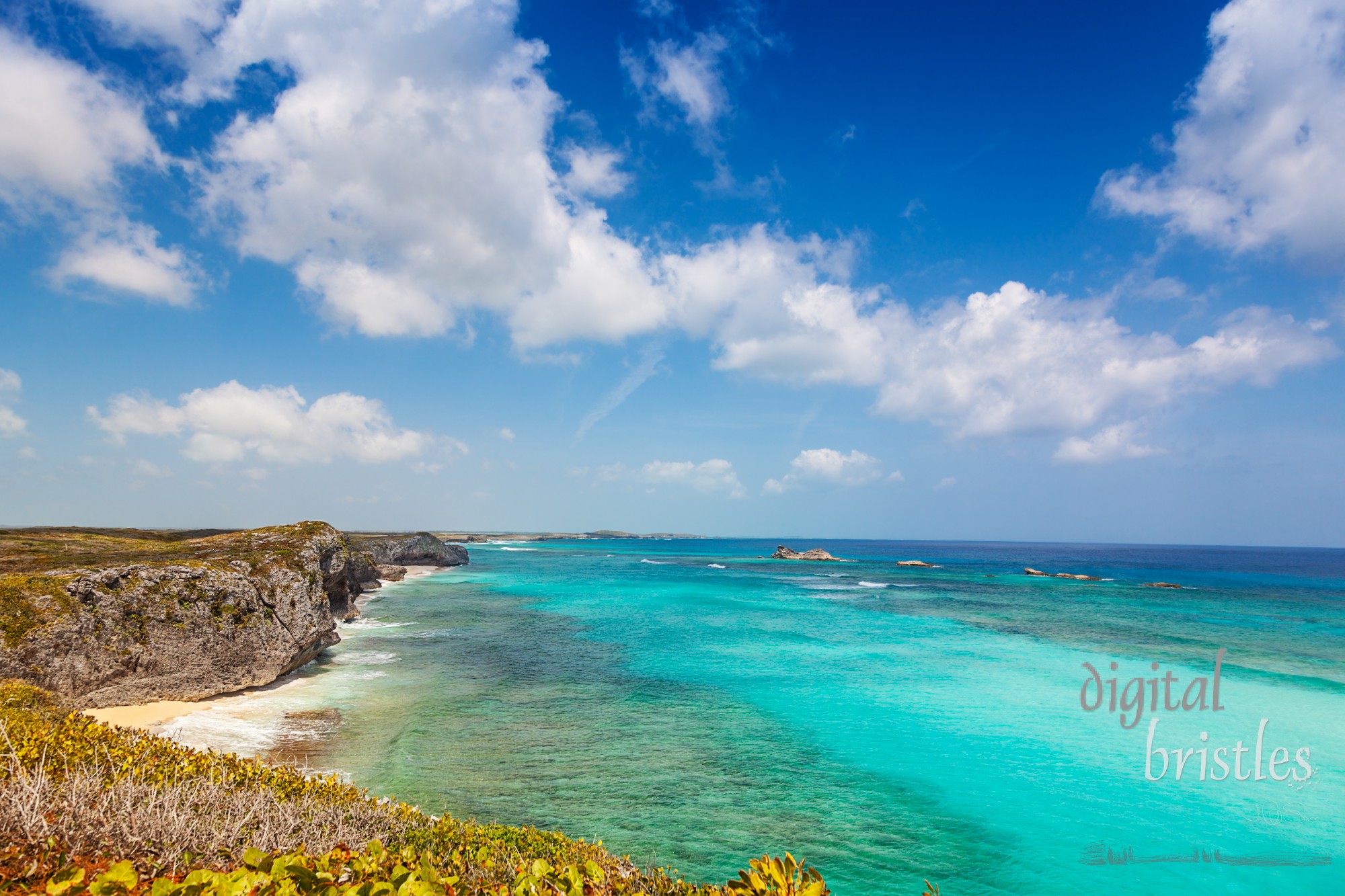 Cliffs, reef and turquoise shallows at Mudjin Harbor, Middle Caicos