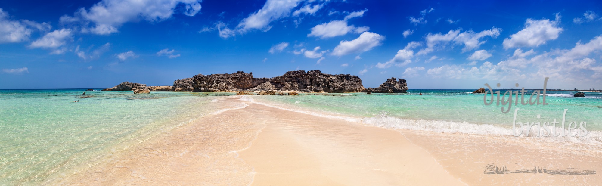 Dragon Cay at low tide with the sandy causeway and rocks mostly exposed, Mudjin Harbor, Middle Caicos