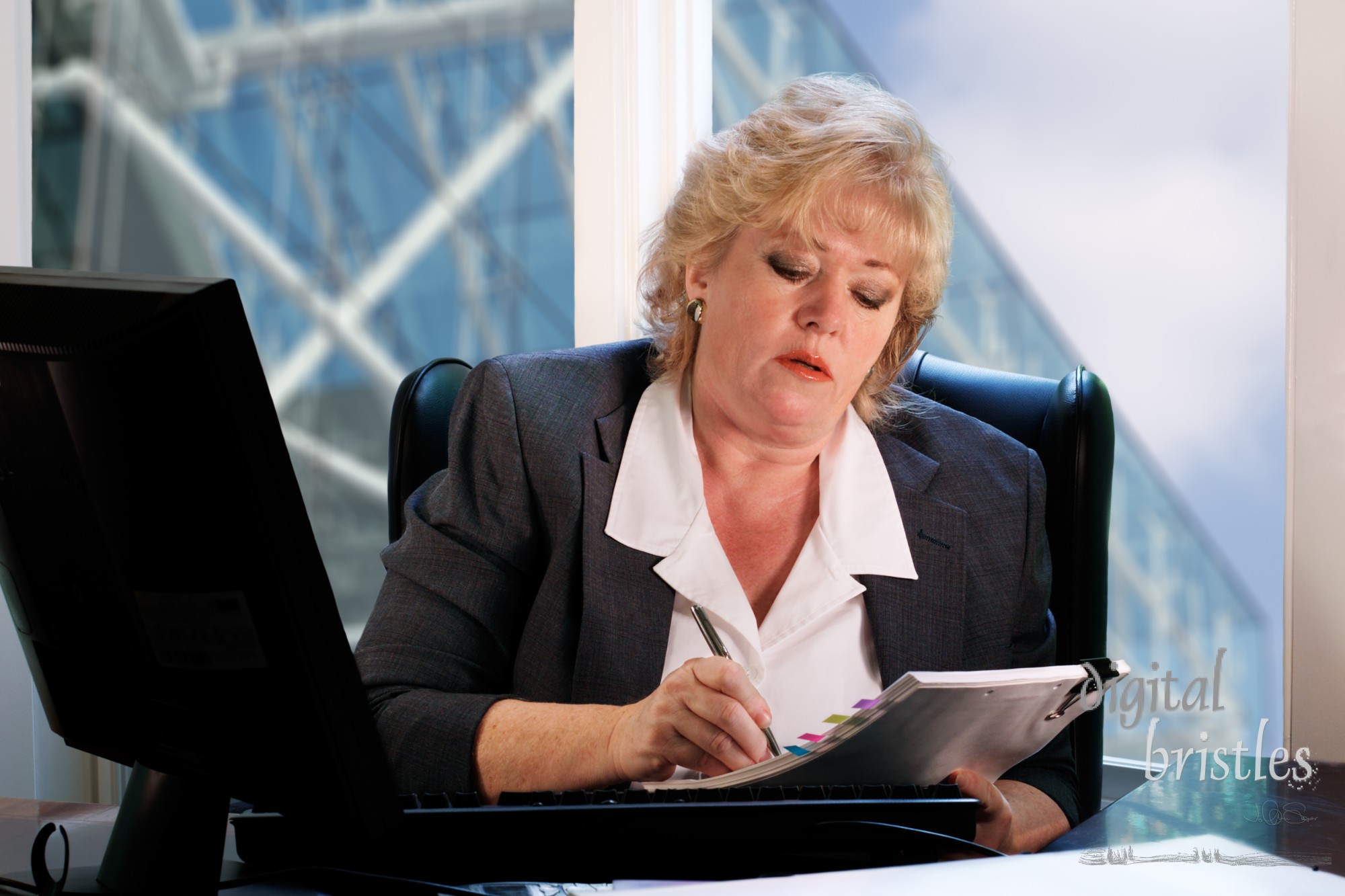 Businesswoman reviewing paperwork