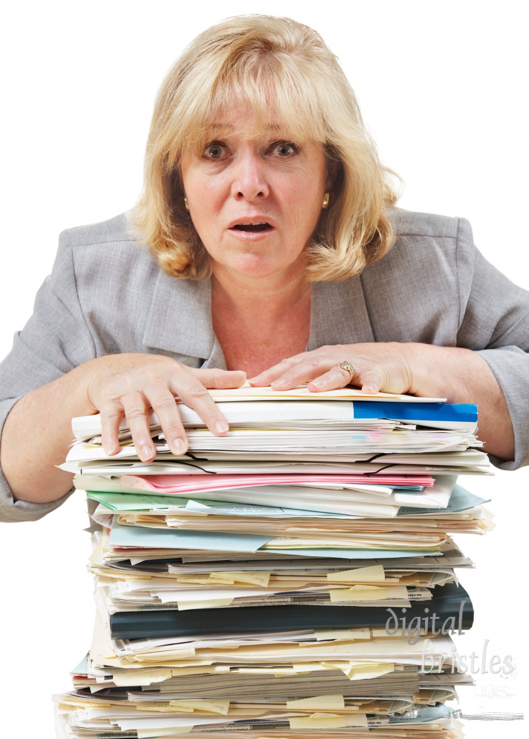 Mature woman distressed at the pile of work to be done